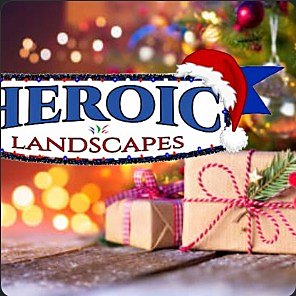 Warm bokeh string lights behind wrapped gifts — Heroic Landscapes seasonal artwork.